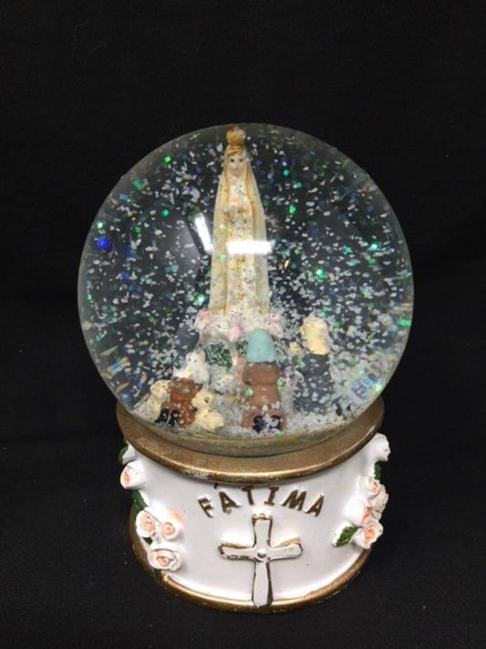 Blessed Virgin Mary Our Lady of Fatima Musical Snow Globe Ornament Figurine Water BallDiscover the Blessed Virgin Mary Our Lady of Fatima Musical Snow Globe. Perfect religious gift, hand-finished and plays "Ave de Fatima". Size: 13 cm.Osiris Craftworks