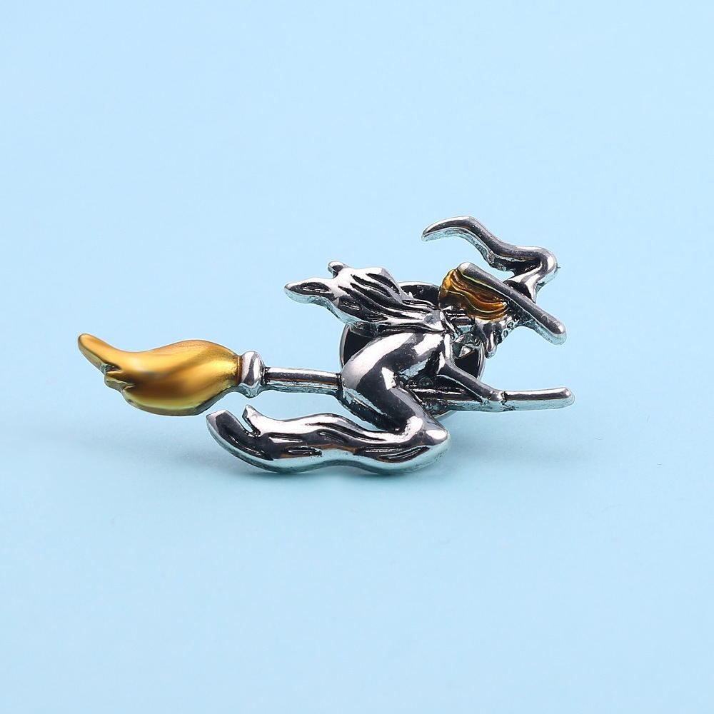 Retro witch riding broomstick brooch